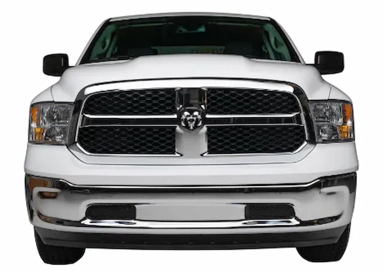 Front view of a white Ram pickup truck with a chrome grille and black accents.