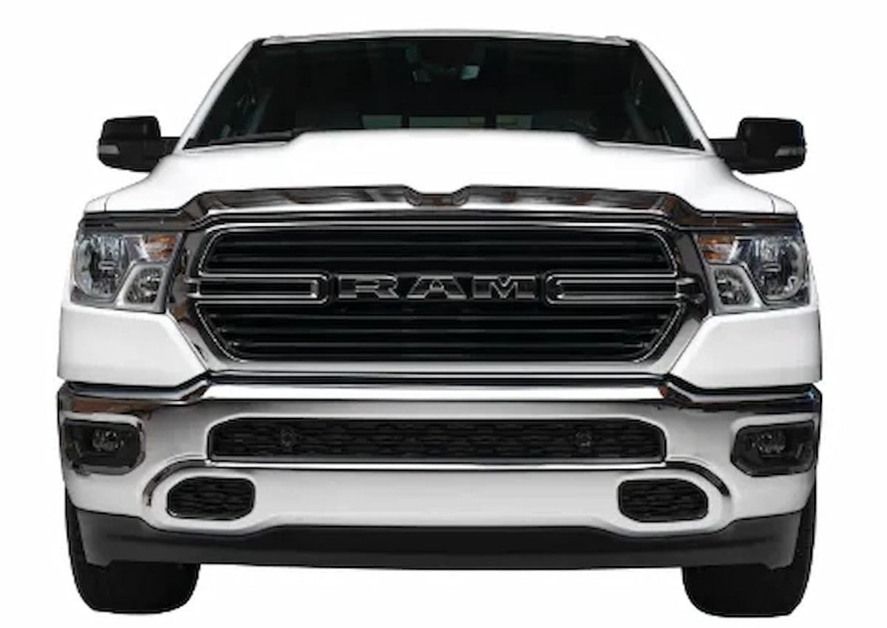 Front view of a white RAM pickup truck with a large black grille.