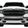 Front view of a white RAM pickup truck with a large black grille.