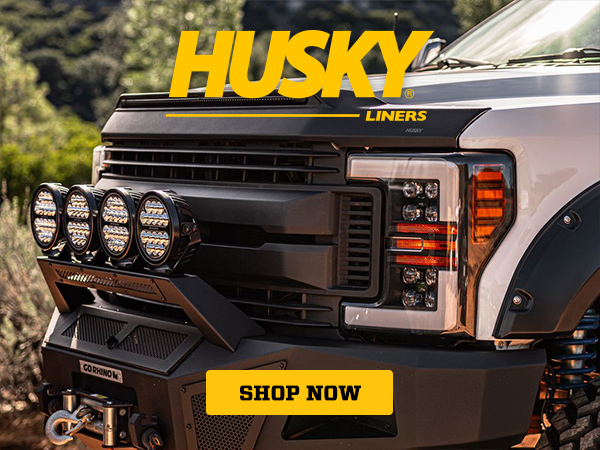 Close-up of a rugged truck front with extra lights — Husky Liners — Shop Now