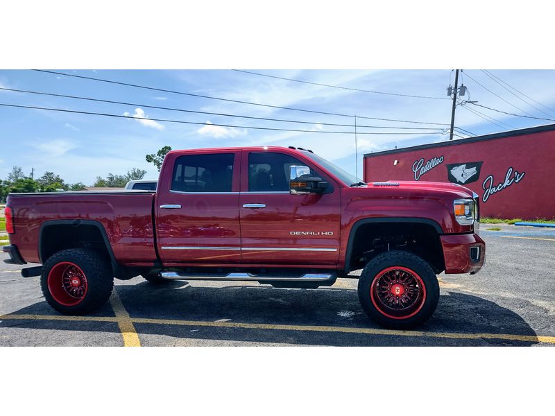 Zone 3" level kit with 2" rear blocks, Vision Candy Red 22x12 -51 offset, Power Venom XT 33x12.50